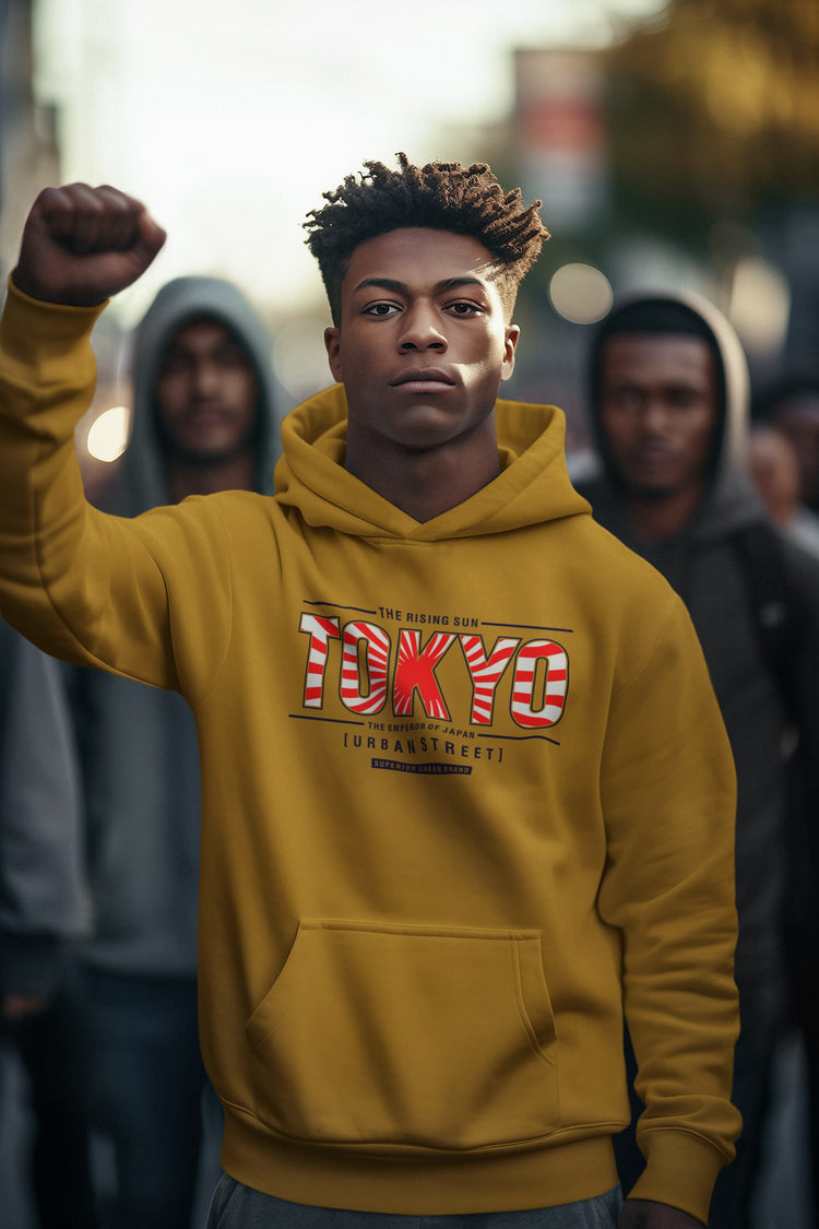 Person wearing a yellow hoodie with &