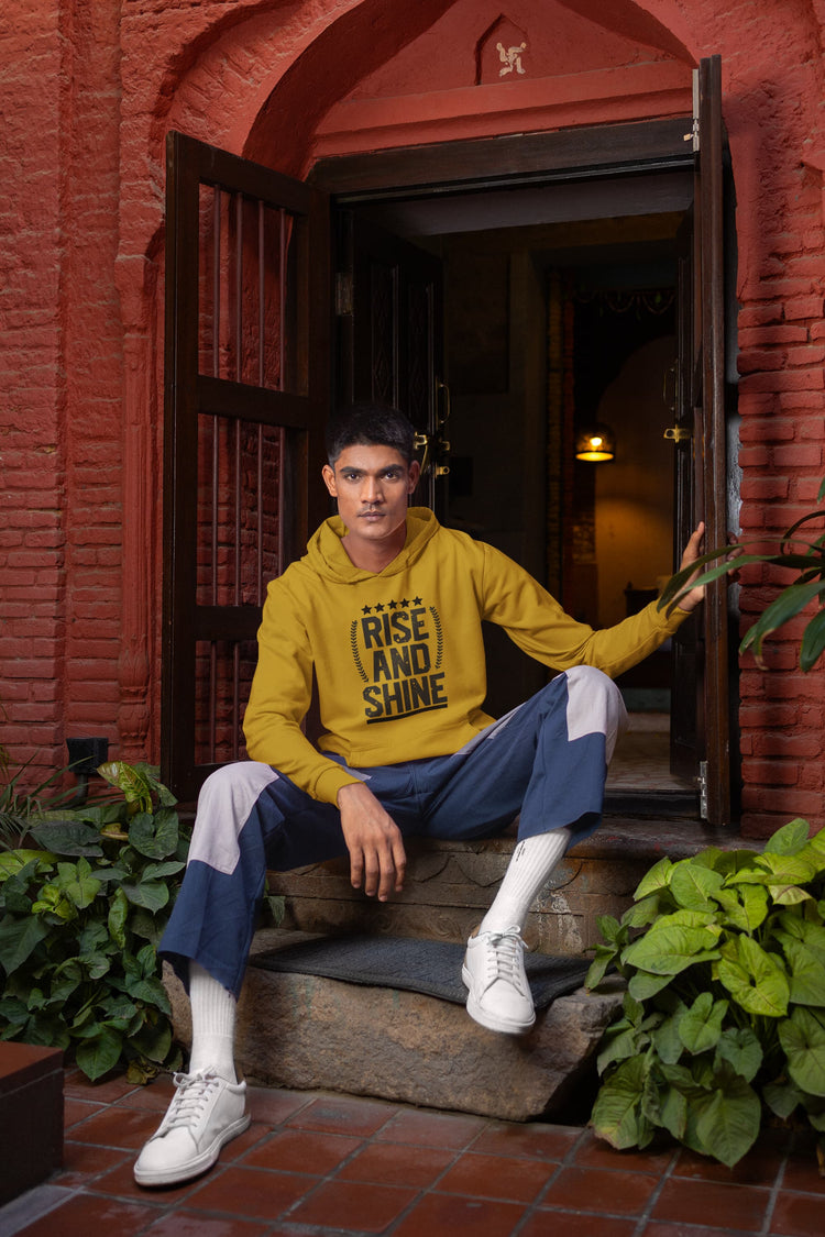 Person wearing a yellow hoodie with &