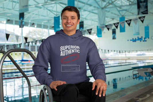Person wearing a hoodie with 'Superior Authentic' text in an indoor pool setting