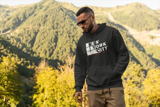 Man wearing a black hoodie with &