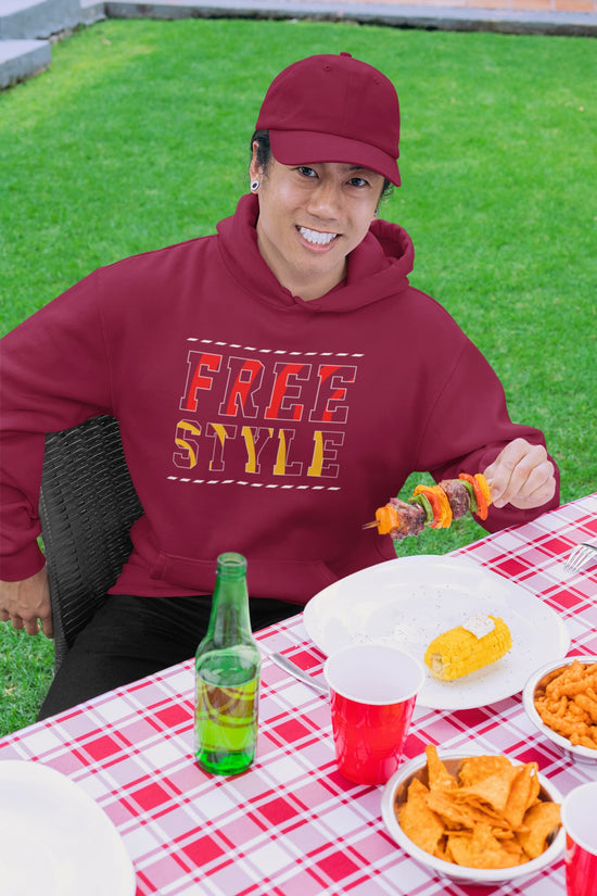 Person wearing a maroon hoodie with &