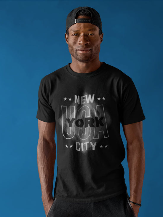 Man wearing a black t-shirt with &