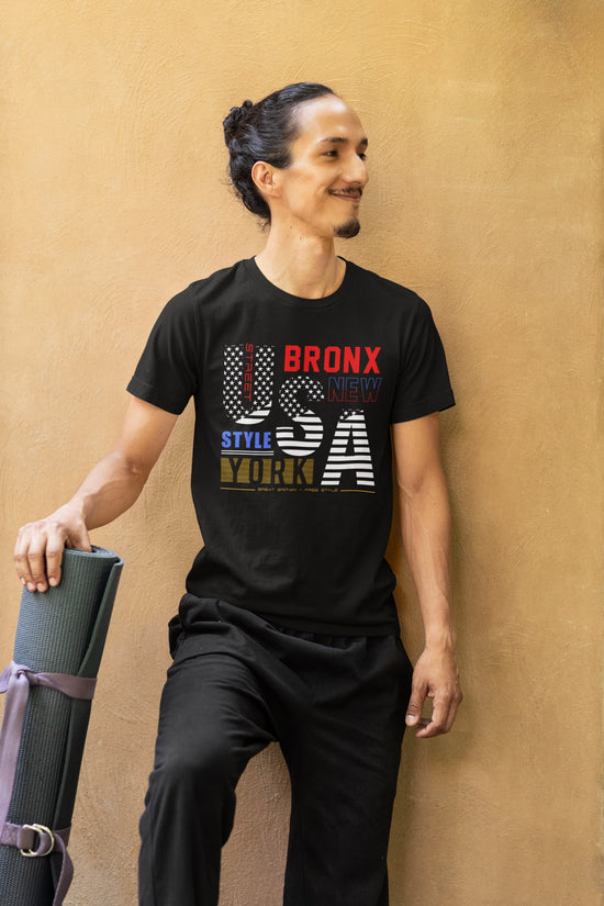 Person wearing a black t-shirt with &