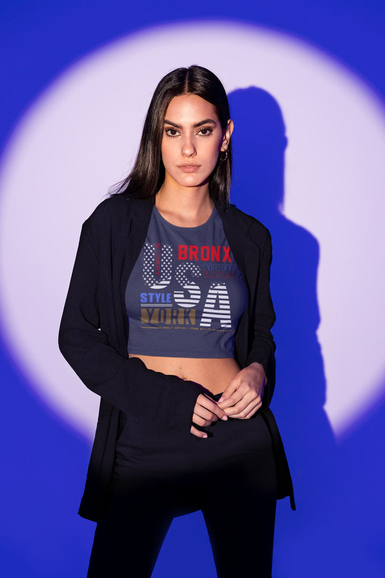 Woman wearing a graphic t-shirt with text against a blue and white background