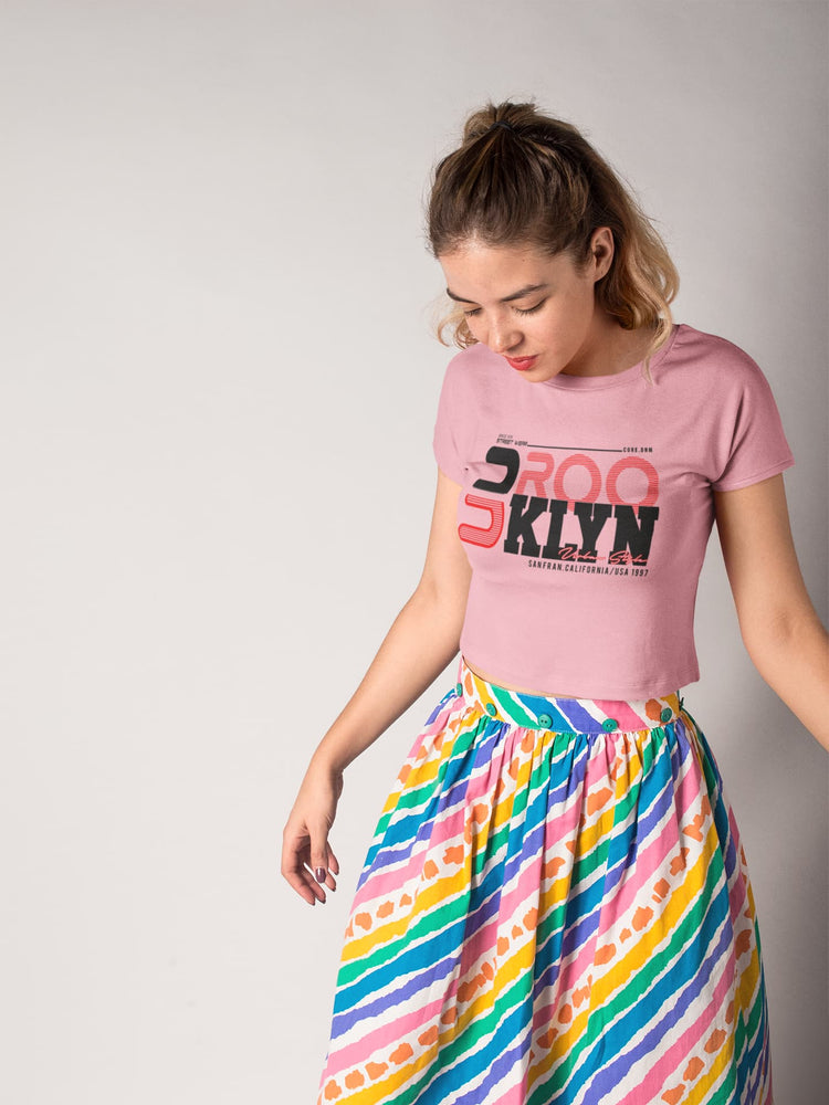 Woman wearing a pink t-shirt with &