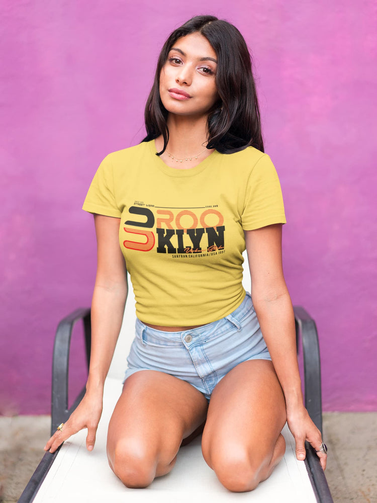Woman wearing a yellow t-shirt with &