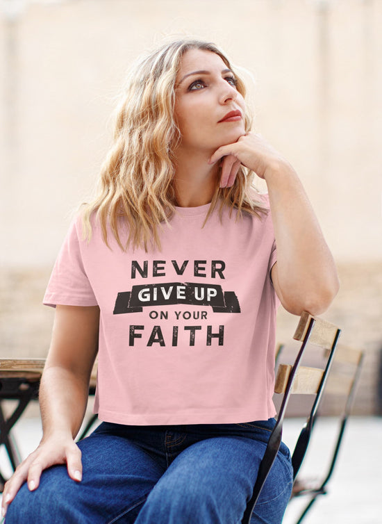 Woman wearing a pink t-shirt with &