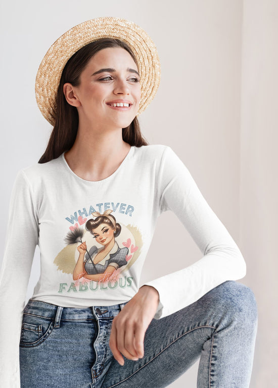 Woman wearing a white long-sleeve shirt with a graphic design and text, sitting against a plain background.