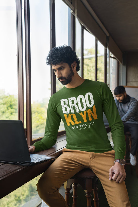 Man wearing a green &