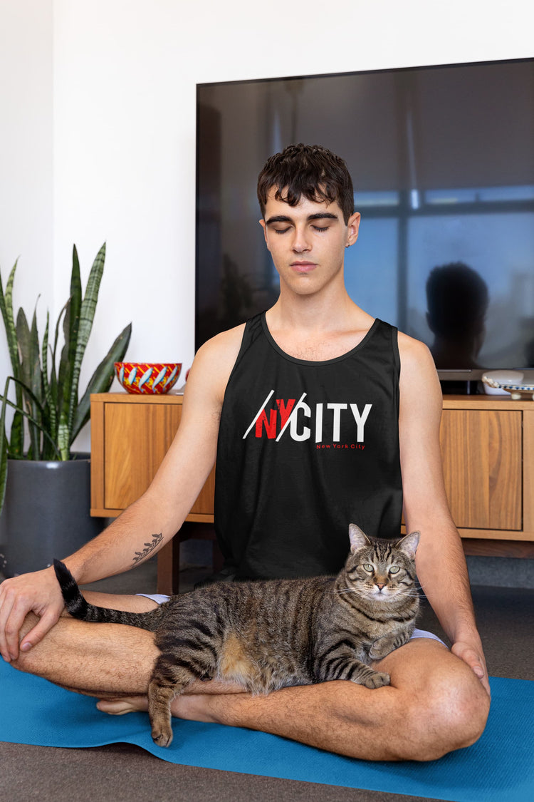Man meditating with a cat on a yoga mat in a room with plants and furniture.