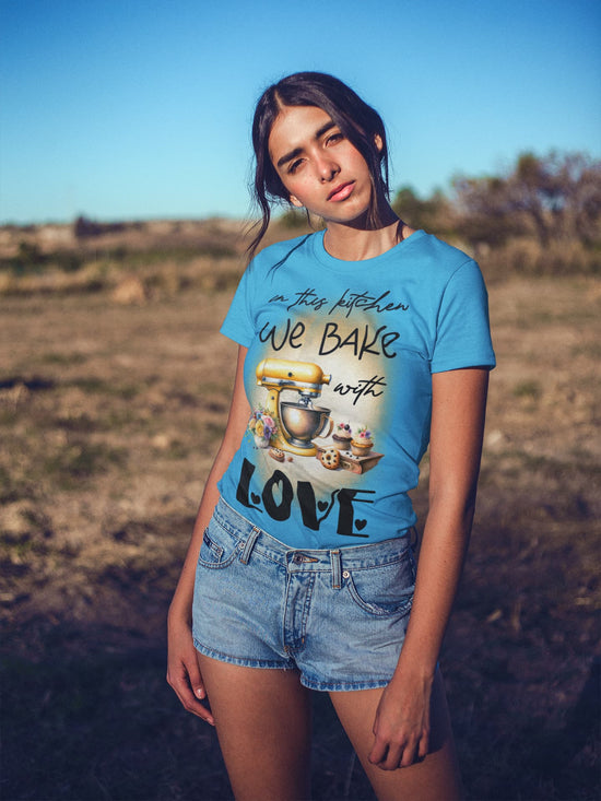 Person wearing a blue t-shirt with a graphic design outdoors