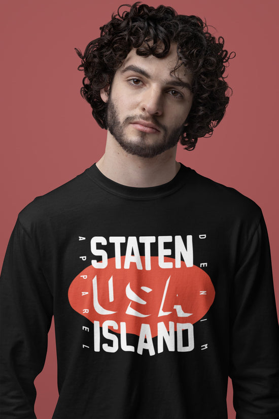 Man wearing a black sweatshirt with &