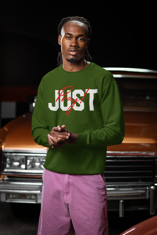Man wearing a green sweatshirt with &