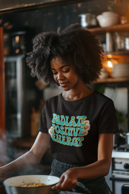 Person wearing a black t-shirt with &