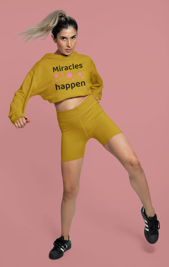 Woman wearing a mustard yellow outfit with &