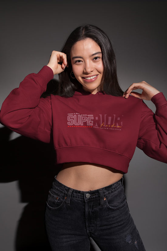 Person wearing a maroon hoodie with &