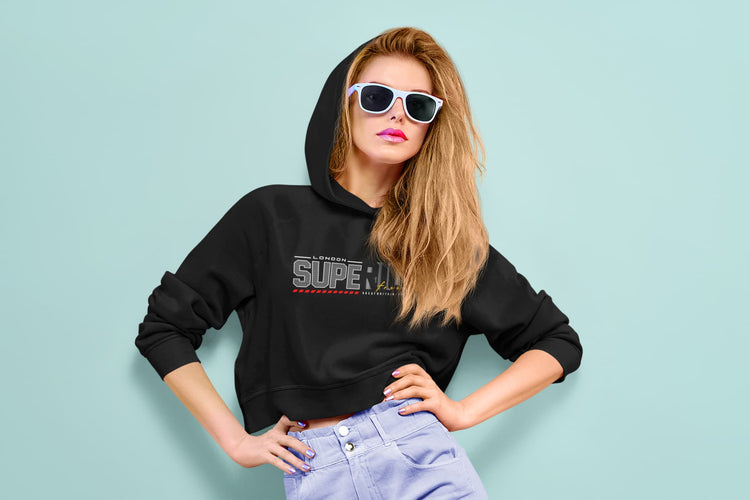 Woman wearing a black hoodie with &