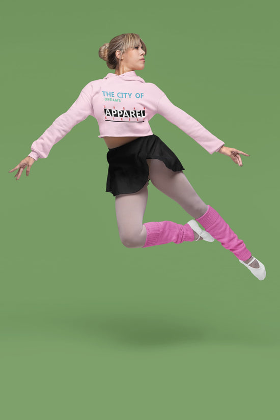 Person in pink jacket and black skirt with &