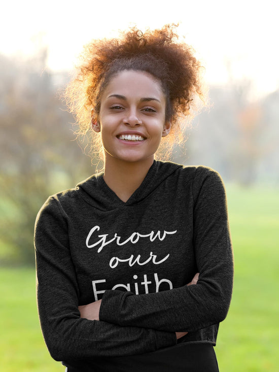 Woman wearing a black hoodie with &