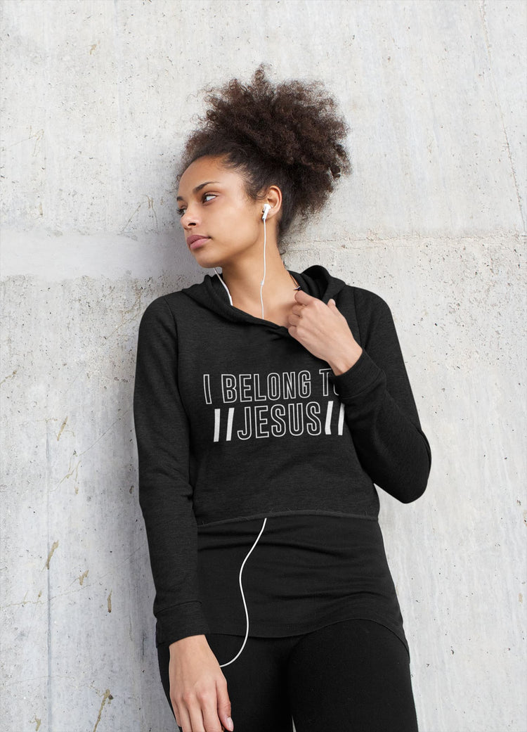 Woman wearing a black hoodie with &