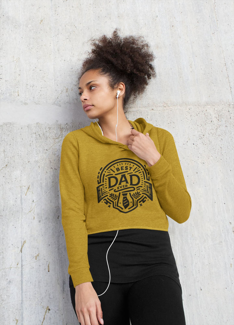 Woman wearing a mustard yellow hoodie with &