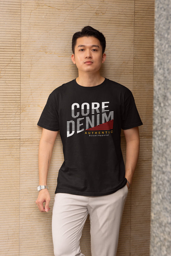 Man wearing a black t-shirt with &