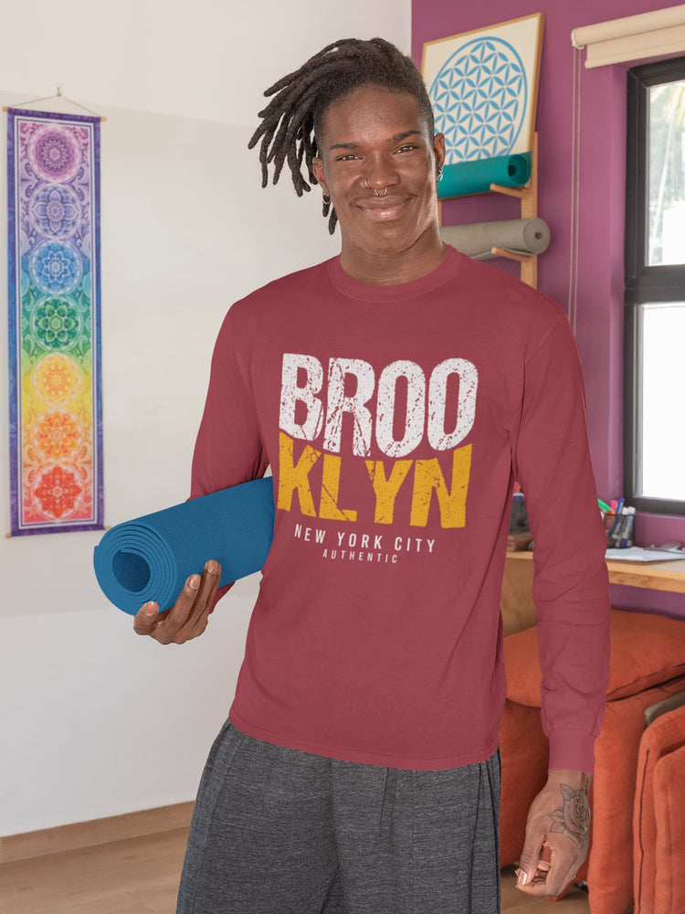 Person wearing a red sweatshirt with &