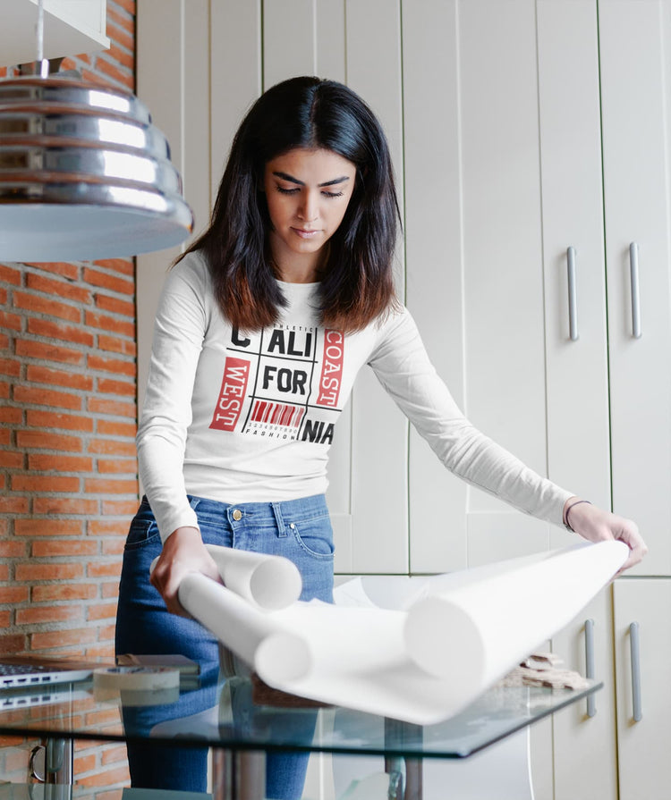 Woman in a kitchen holding a large roll of paper