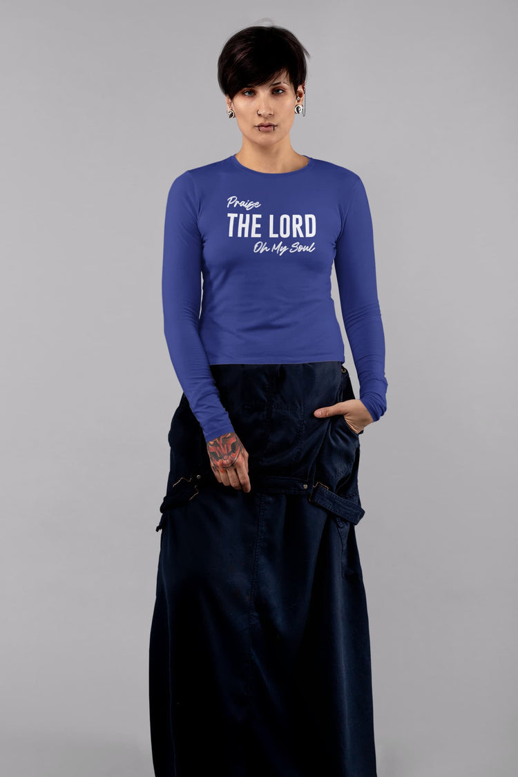 Person wearing a blue long-sleeve shirt with text on a gray background