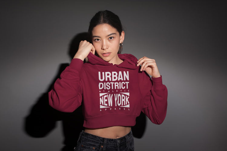 Person wearing a maroon hoodie with &