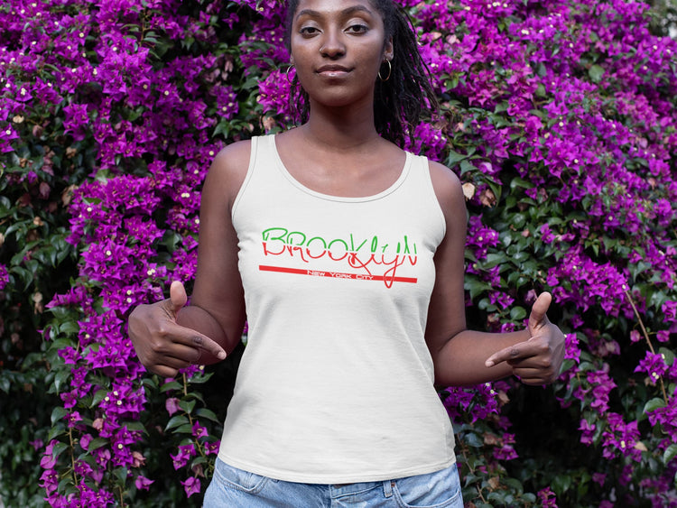 Person wearing a white tank top with &