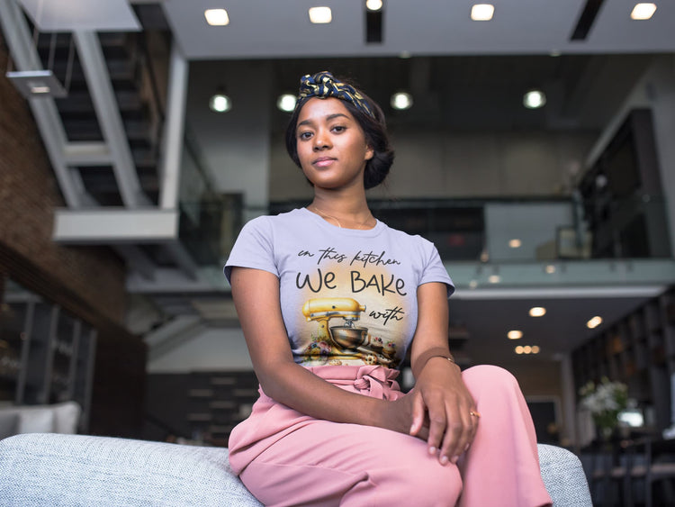 Woman wearing a t-shirt with a graphic design in an indoor setting