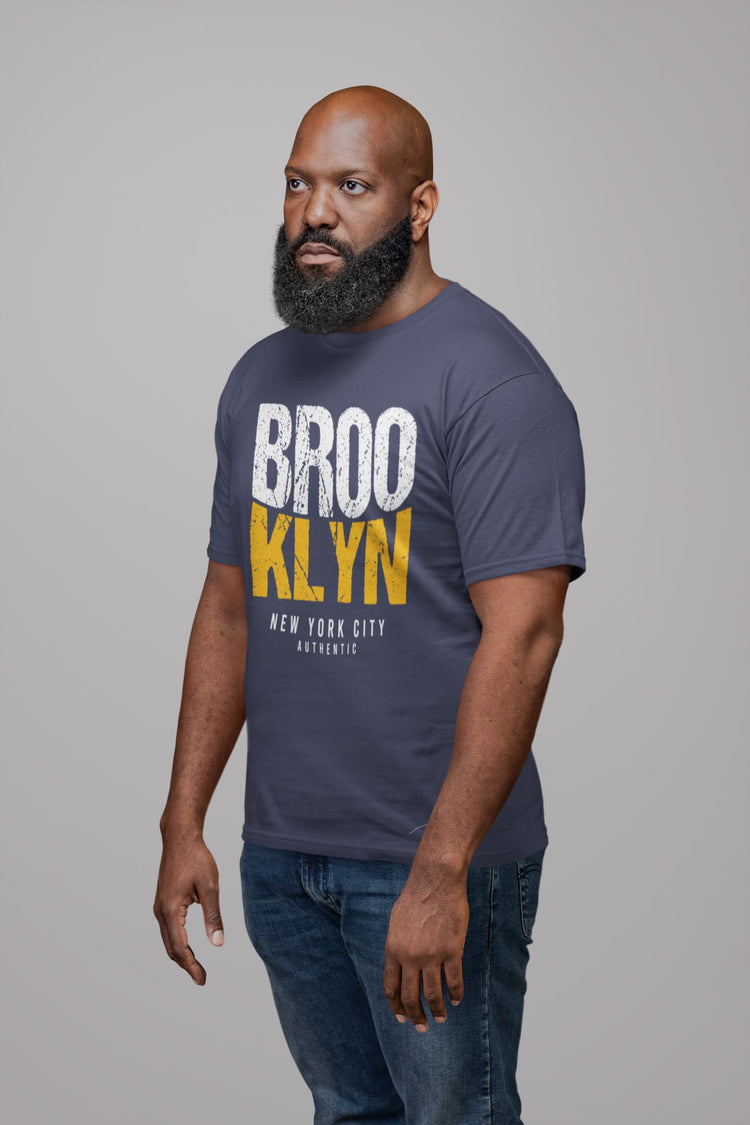 Man wearing a navy blue t-shirt with &