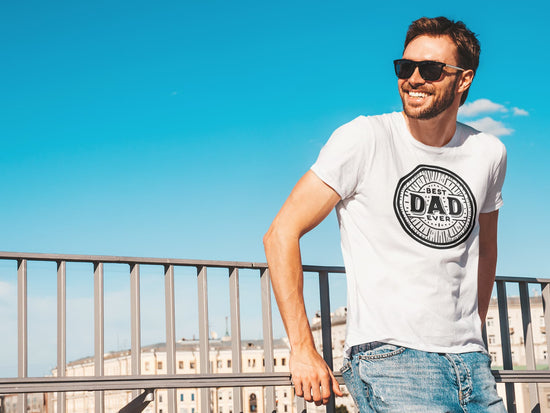 Man wearing a white t-shirt with &