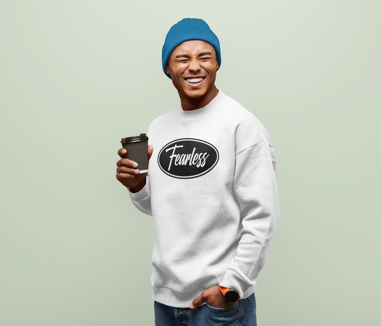 Person wearing a white sweatshirt with &