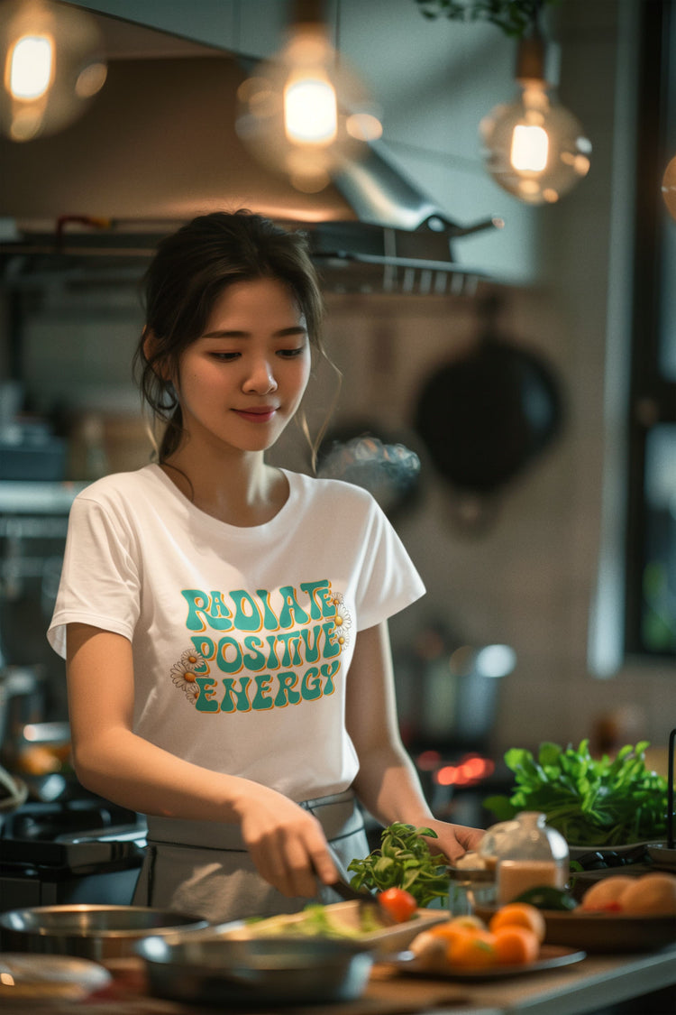 Woman preparing food in a kitchen wearing a &