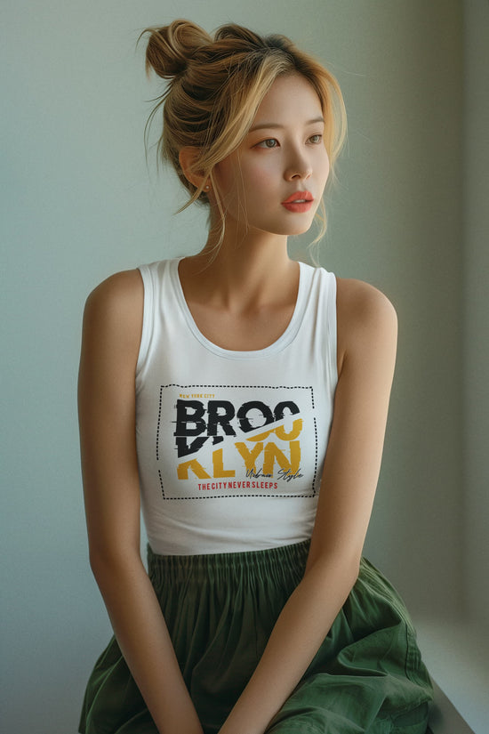 Woman wearing a white tank top with &