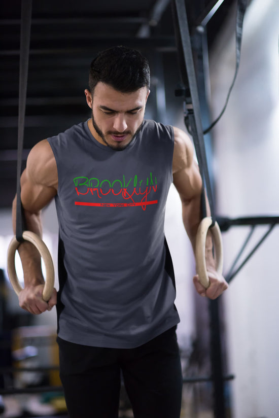 Man exercising with gymnastic rings in a gym setting