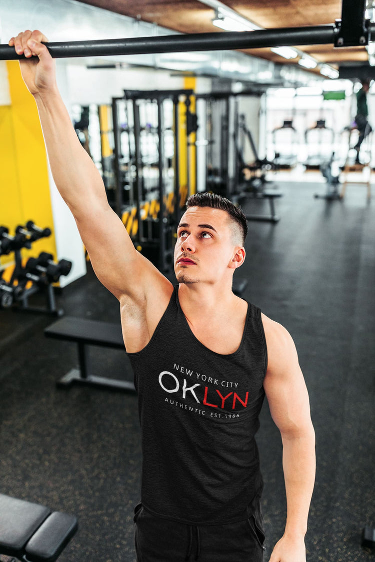 Man in a gym wearing an &