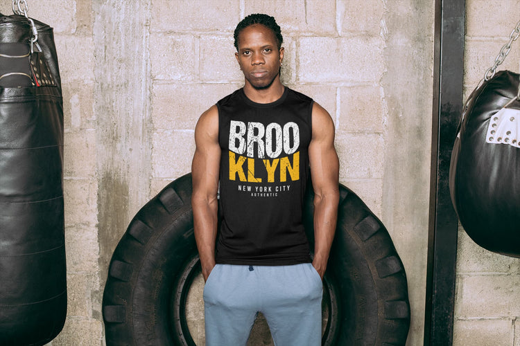 Man wearing a black tank top with &