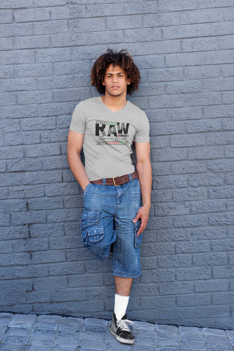 Person wearing a gray t-shirt with &