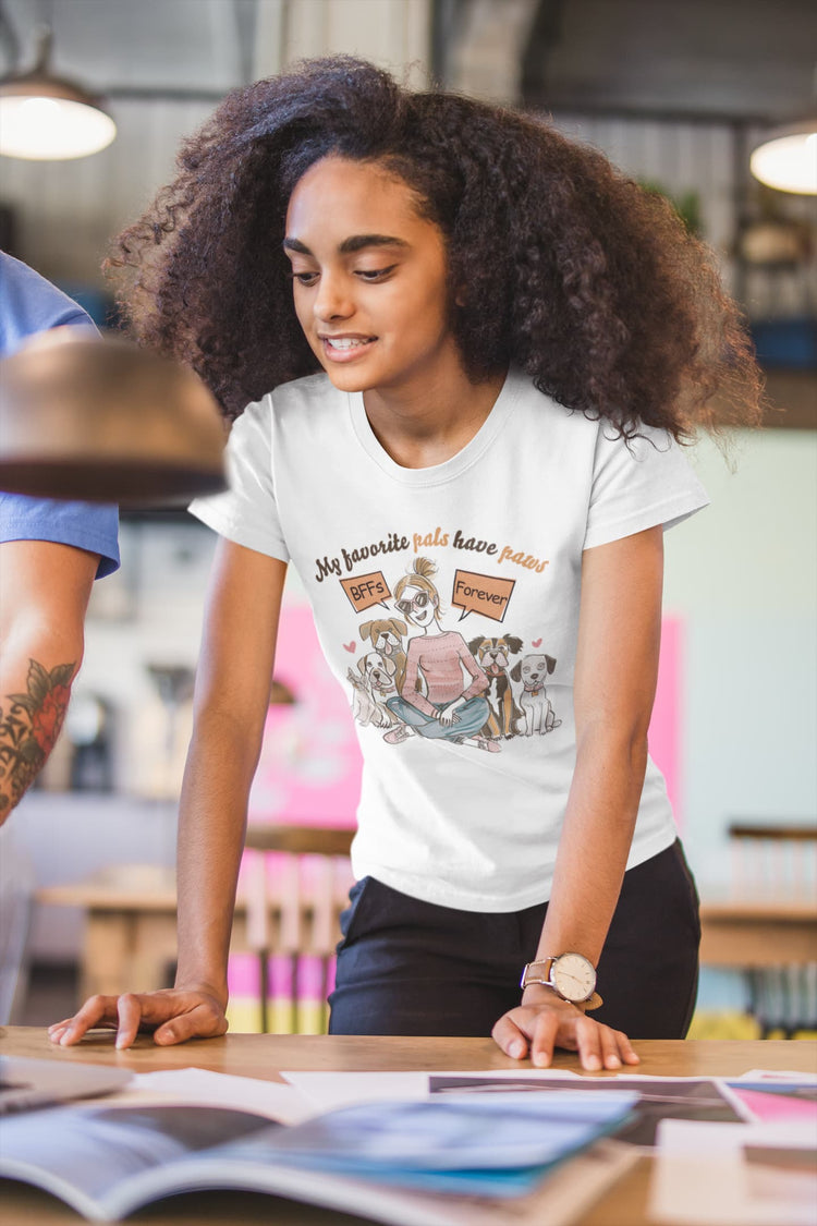 Person wearing a white t-shirt with graphic design in a casual setting