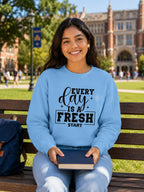 karavirs™ Morning Reset Sweatshirt detail — evolve typography graphic