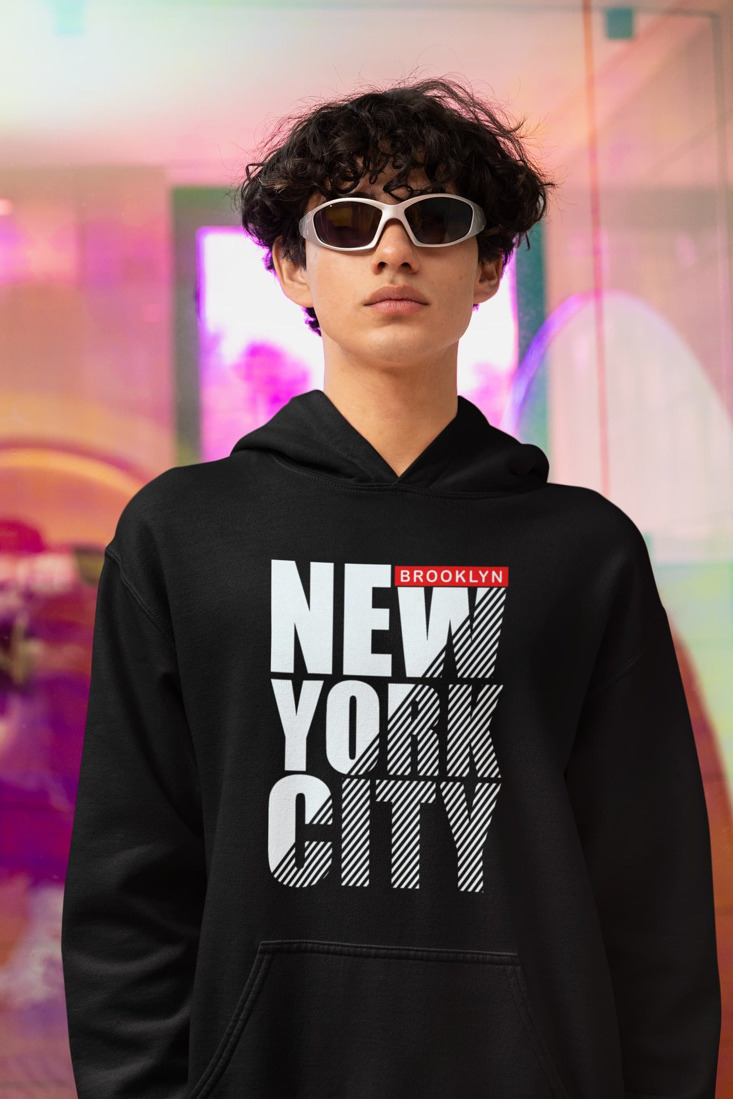 Person wearing a black hoodie with &