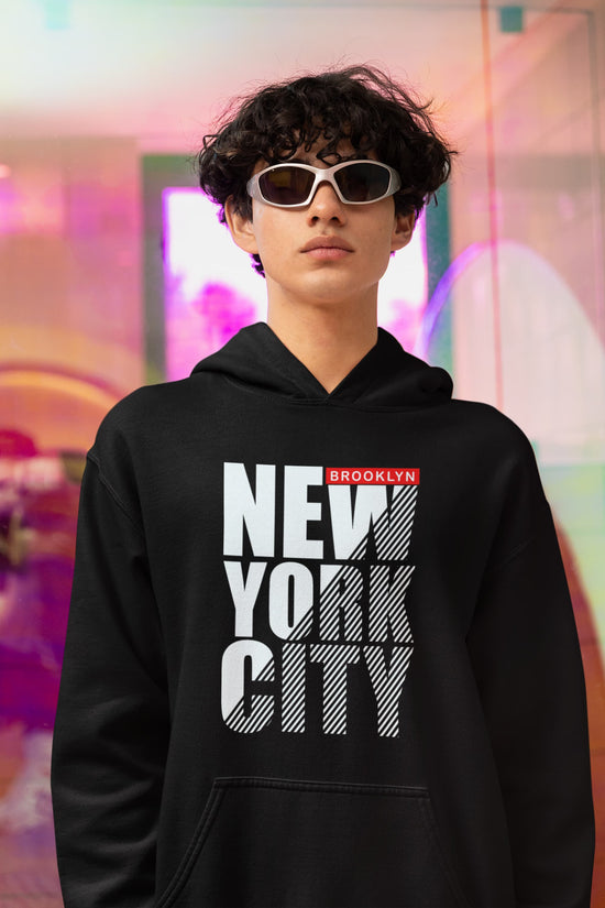 Person wearing a black hoodie with &