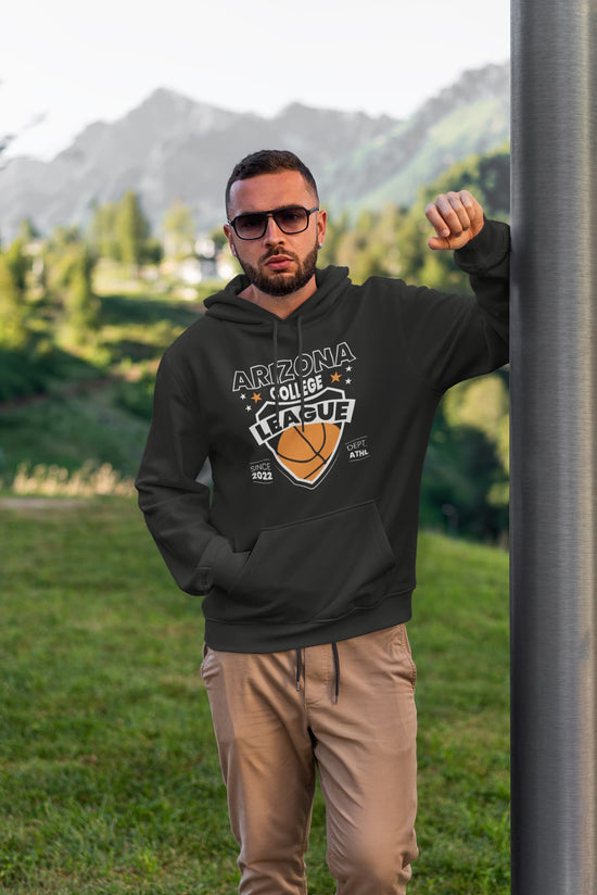 Man wearing a black hoodie with &