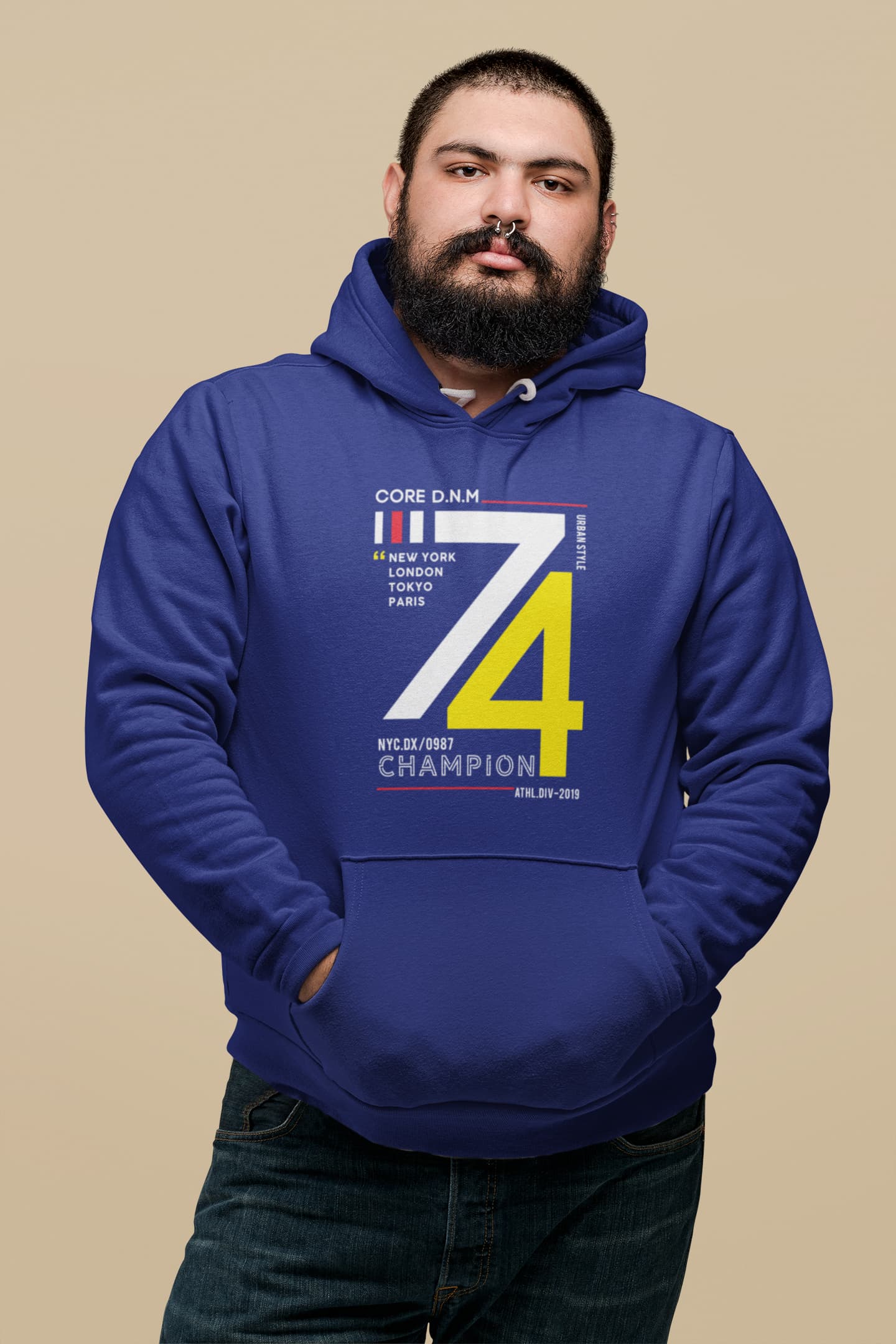 Man wearing a blue hoodie with text and numbers on a beige background