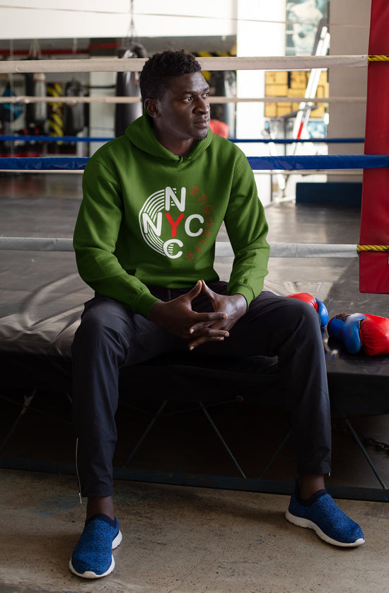 Person wearing a green hoodie with &