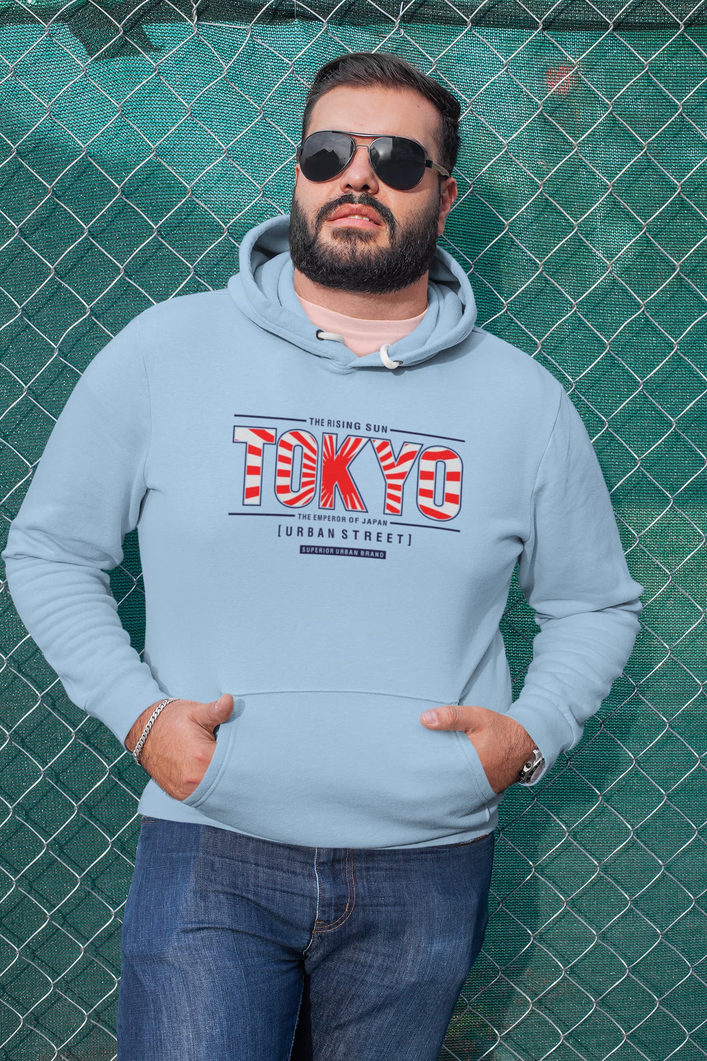 Man wearing a light blue hoodie with &