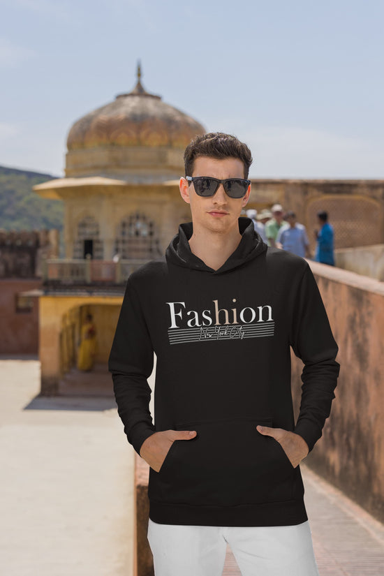 Man wearing a black hoodie with &
